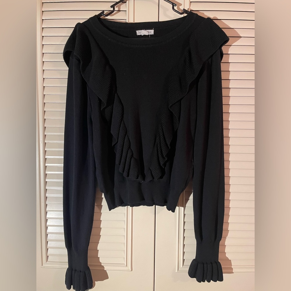 black sweater with frills